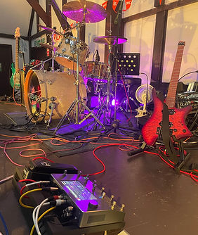Flashback Band stage setup with electric guitars and drum kit for live performance in Oxfordshire