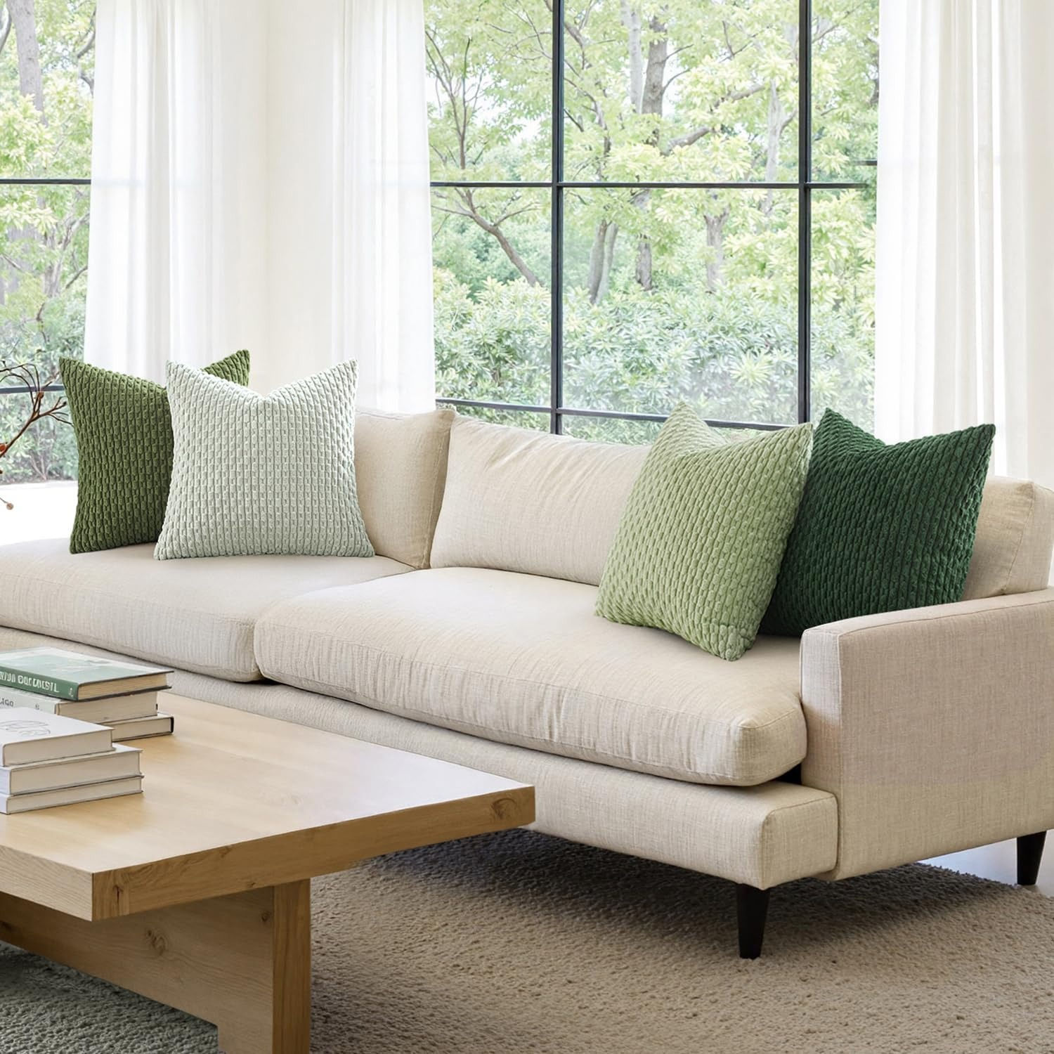 The Heirloom Corduroy Stripe Cushion on a cream sofa.