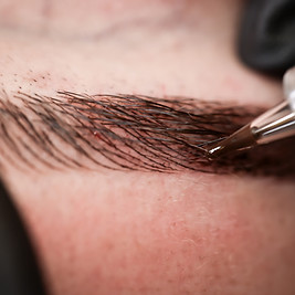 Microblading eyebrows, getting facial care and tattoo at beauty salon.jpg