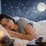 Woman sleeping peacefully in bed with moon and starry sky backdrop. Candle and crystals on nightstand create a calm, serene mood.