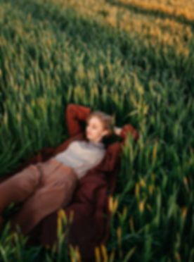 Woman Laying in Field