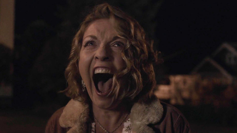 A woman screaming.