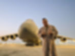 U.S. Army pilot standing in front of a military aircraft