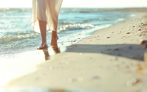 6997890-mood-girl-legs-sand-beach-sea-waves.jpg