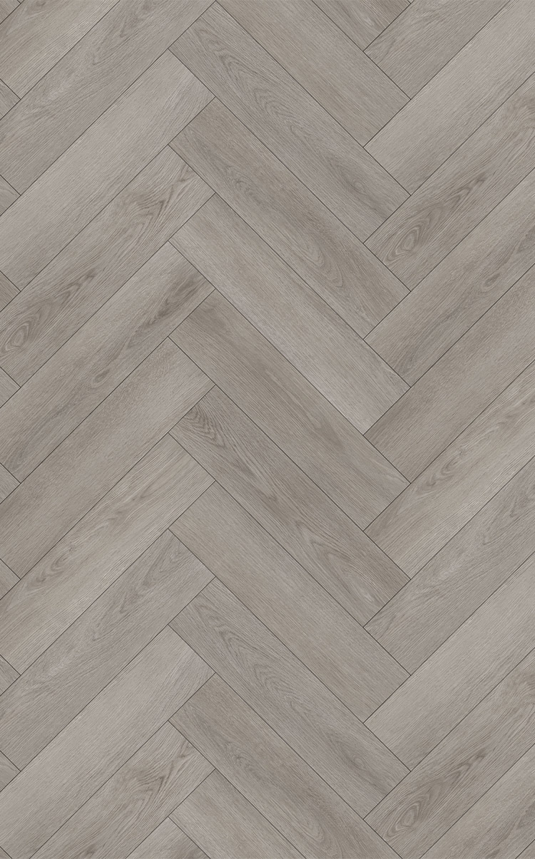 A medium grey oak effect wood floor in herringbone design