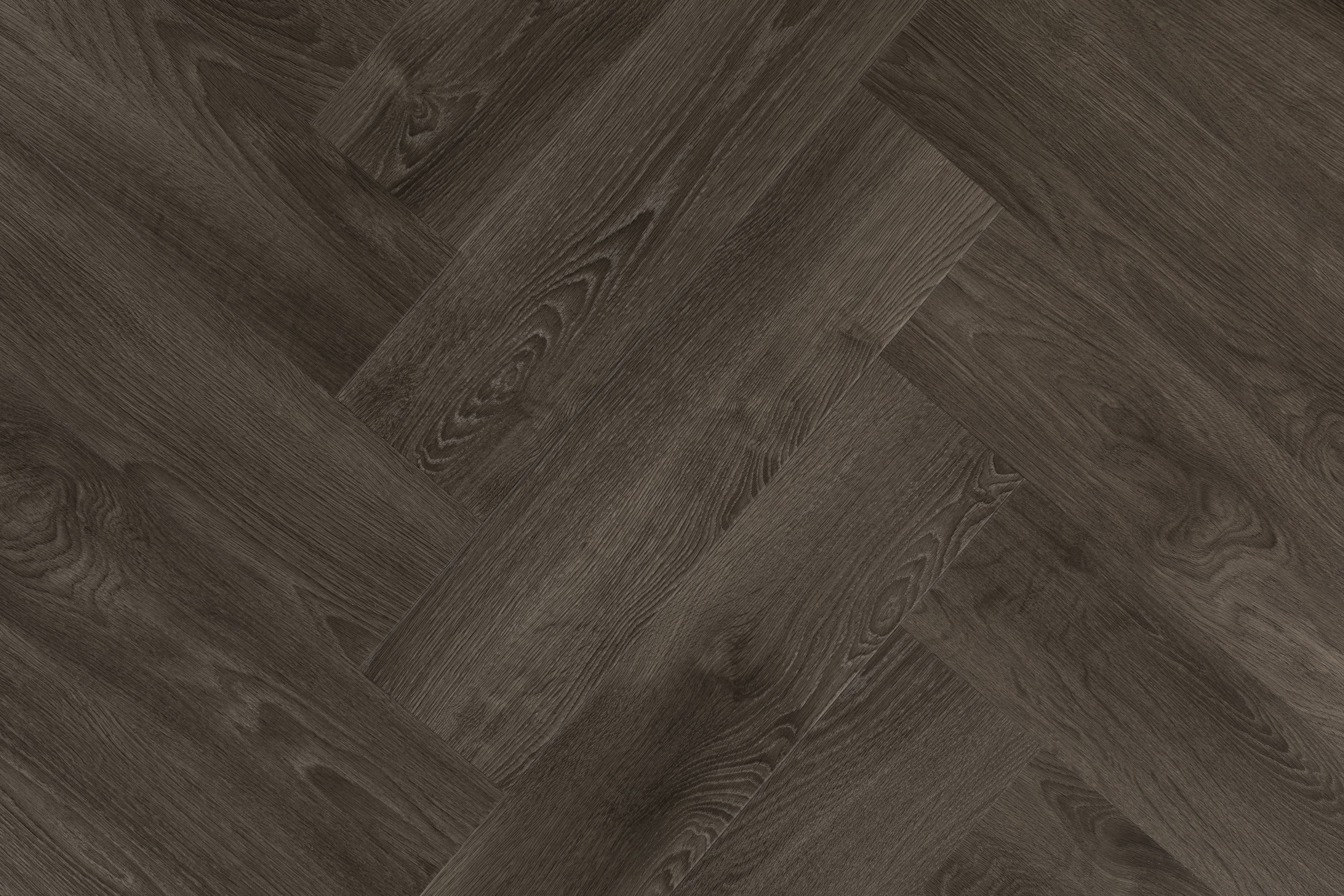 A deep walnut wood effect floor in a herringbone pattern