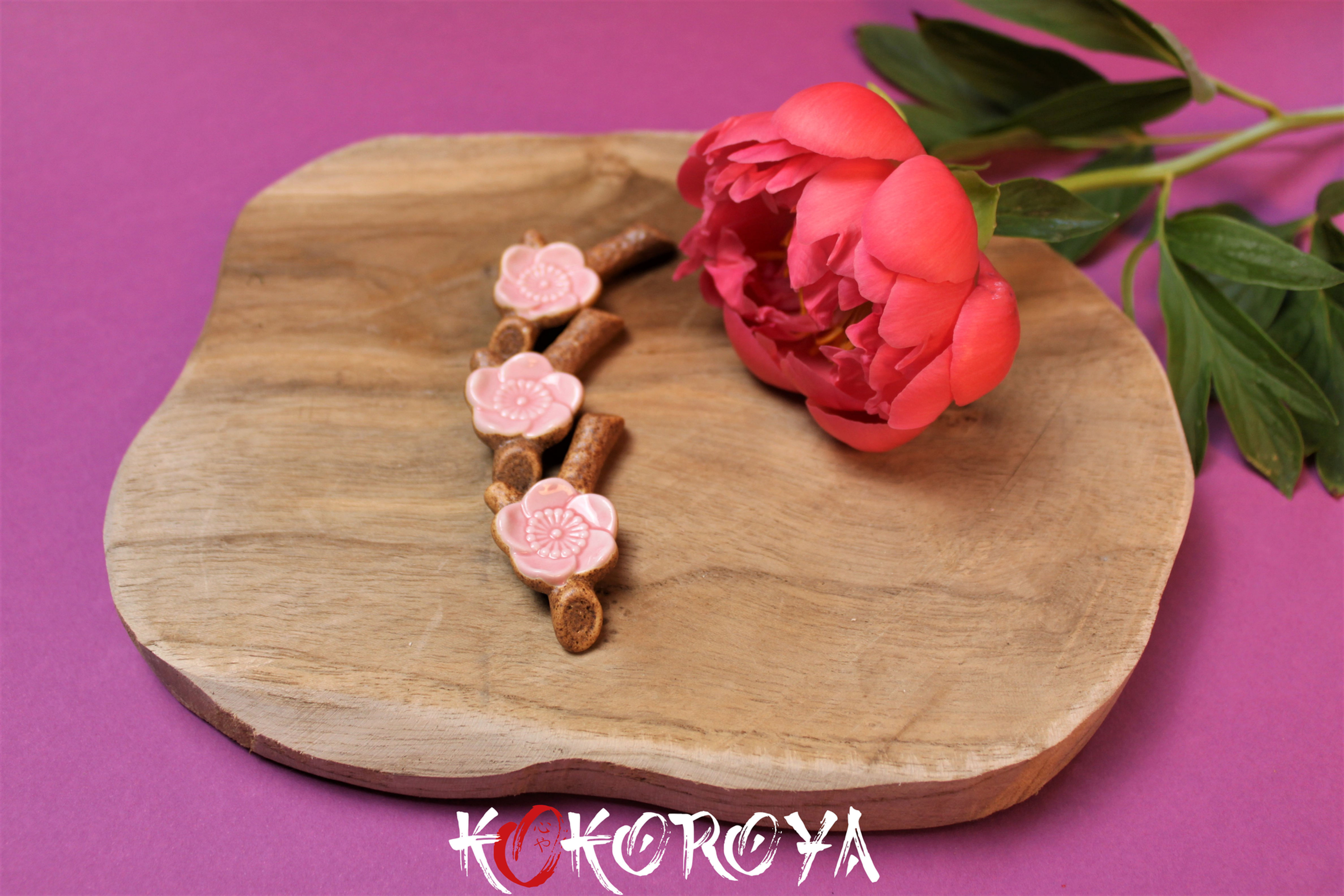 Paires reposes baguettes branche sakura