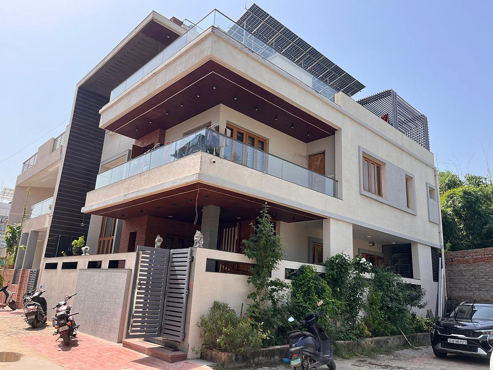 Modern multistory house with solar panels by Patel Construction