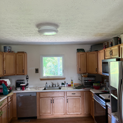 Kitchen casement window above sink providing ventilation and outdoor view