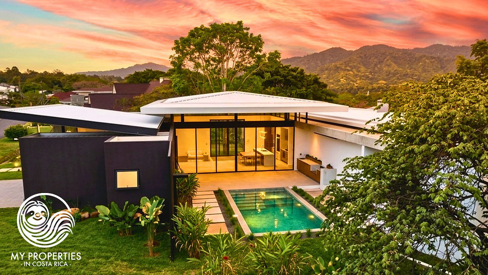 Eye-level view of a modern villa with an infinity pool overlooking the ocean