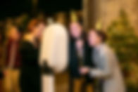 Make The Moment - Group of work friends enjoying photo booth at work party