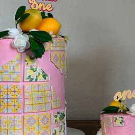 Pink lemon themed birthday cakes with Phoenix One topper