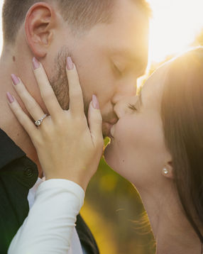 Couple kissing in warm sunset light