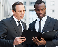 vecteezy_examining-documentation-together-two-confident-business-men_13537839 (1).JPG