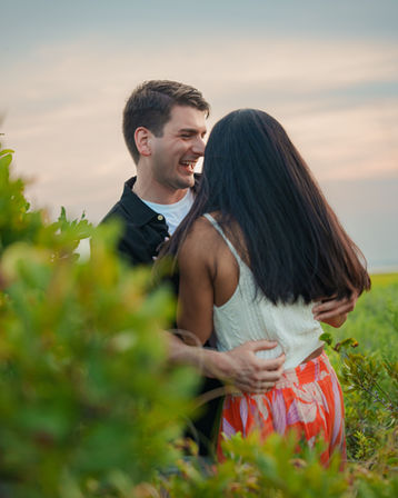 Couple hugging viewed from behind