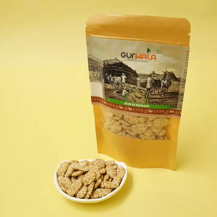 It is a dry sweet made of sesame seeds and jaggery which known as ‘Til’ and ‘Gur’ in Hindi. The Til is cooked in Jaggery syrup and set in thin layers, which can be stored for months.