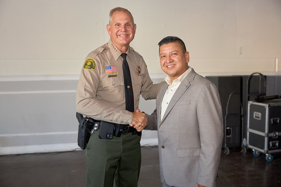 Eye-level view of San Bernardino County Supervisor Jesse Armendarez speaking at a community event