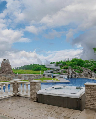 Private pool with waterslide and hot tub at Sethi Farms luxury farmhouse