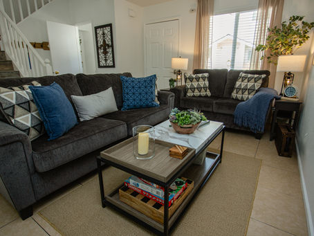 Living room with plush seating and natural light at InestQuest Vacation Rental