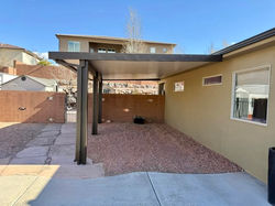 solid aluminum patio cover attached to home in St George