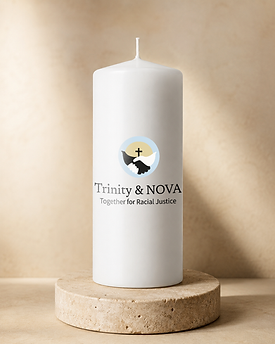 Trinity & NOVA logo applied to a tall white candle against a warm neutral background.