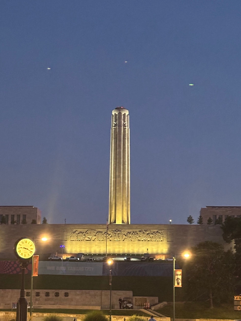 Liberty Memorial tower and Union Station clock at blue hour in Kansas City