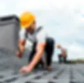 selective-focus-of-roofer-holding-hammer-while-r-2023-11-27-05-33-45-utc.webp