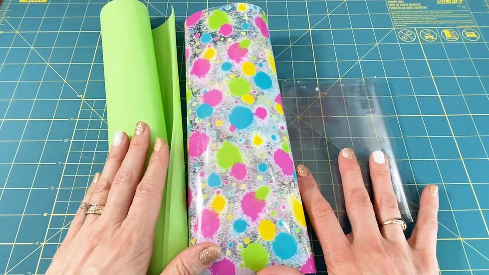 Hands holding jelly vinyl, tpu vinyl and clear vinyl.