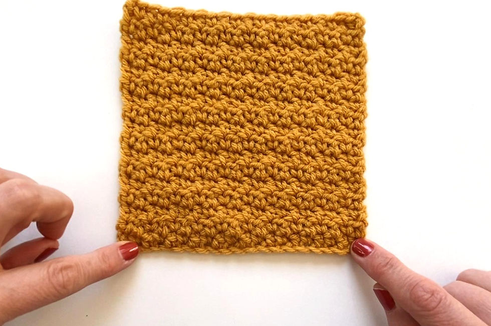 A square crocheted with the lemon peel stitch as a block for a baby blanket and made with I Love This Yarn in Sungold.