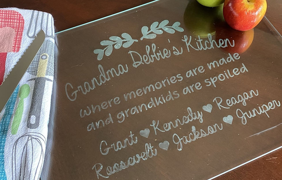 A glass cutting board etched with Armour Etch Etching Cream with a grandma saying on it.