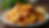 High angle view of golden fried plantains on a plate