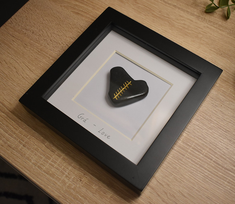 Framed heart-shaped stone with custom gold inscription