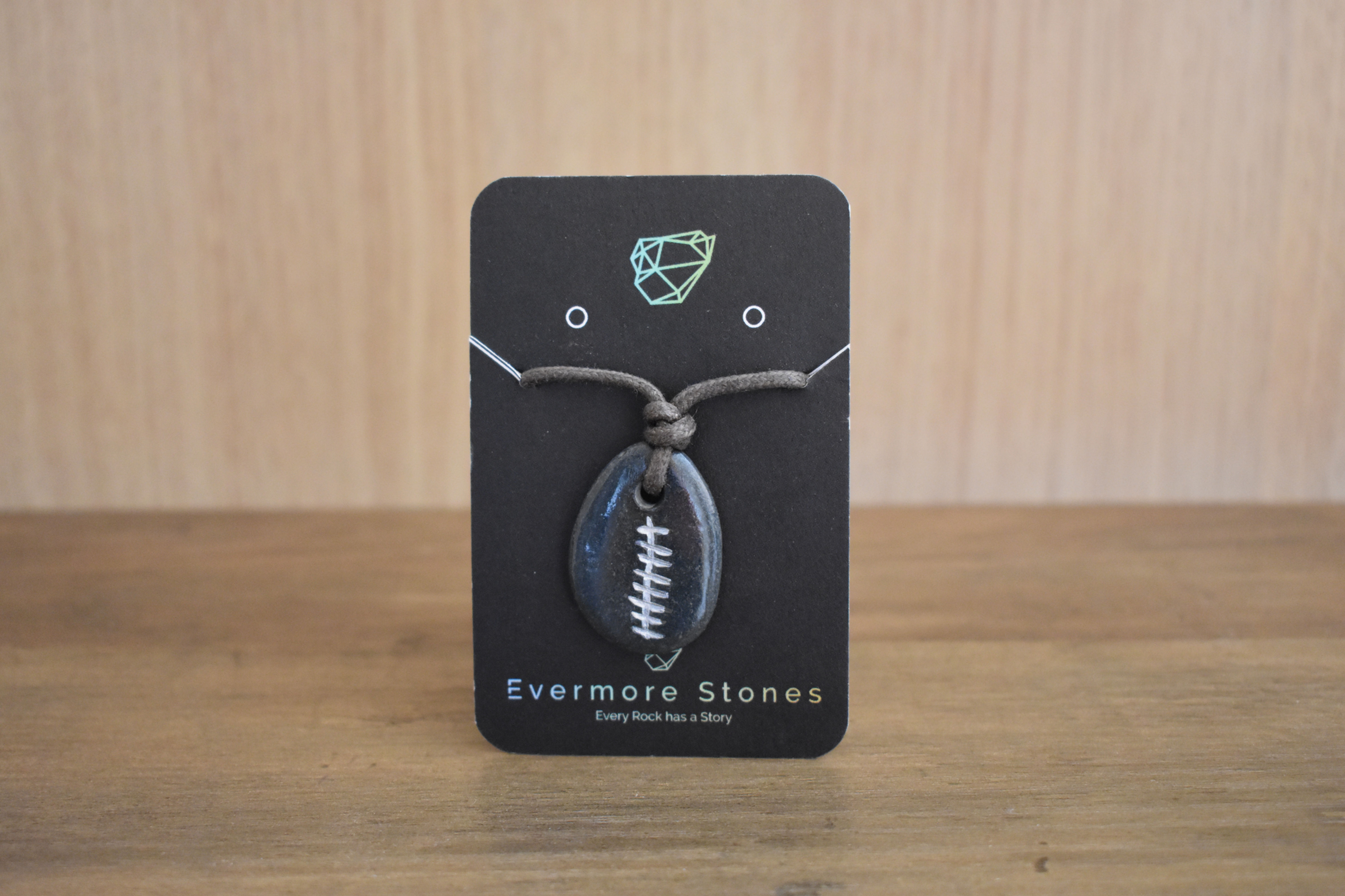 Evermore Stones Grá Love Pendant on a black display card