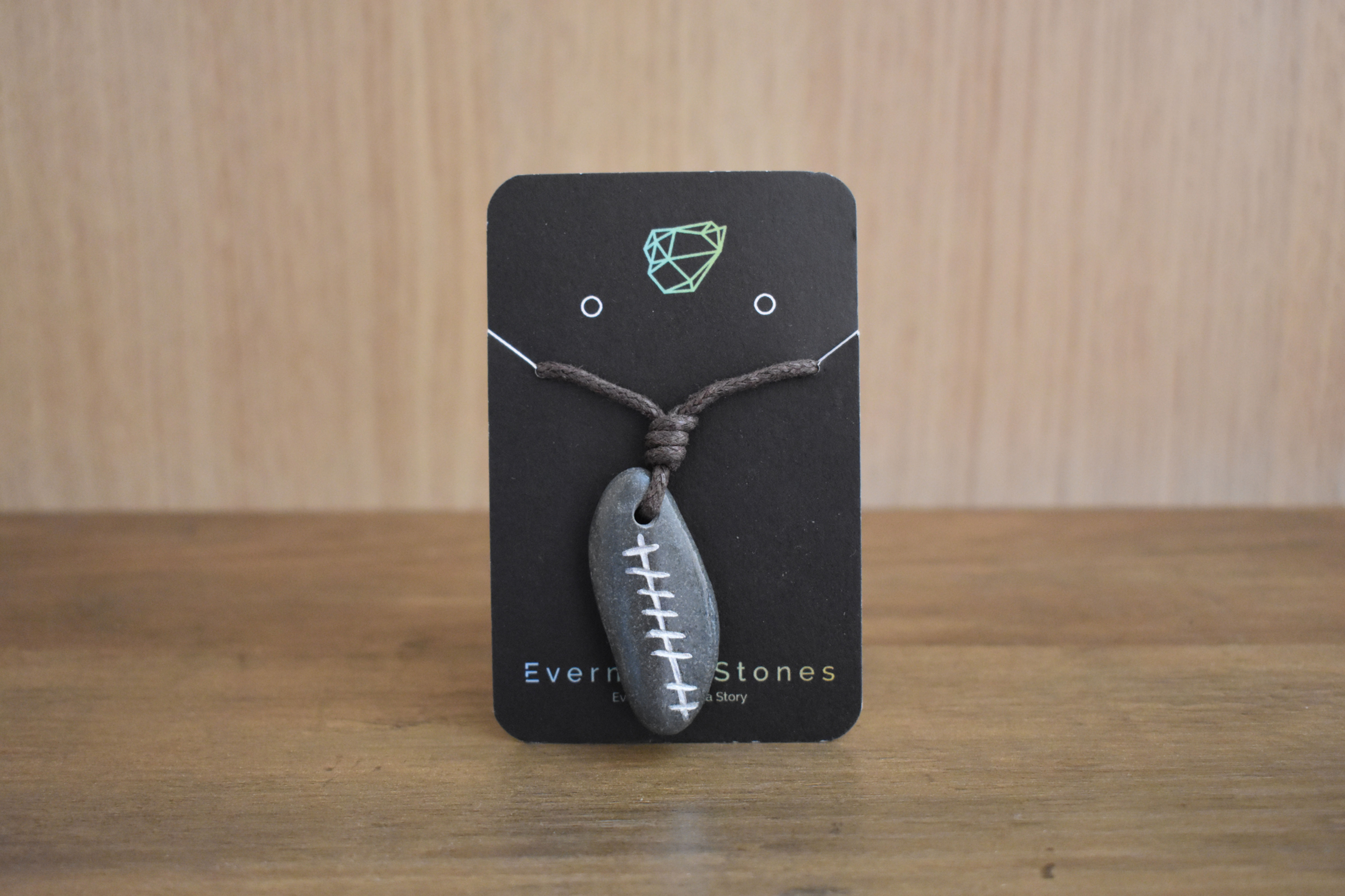 Grá Love Pendant on a black display card
