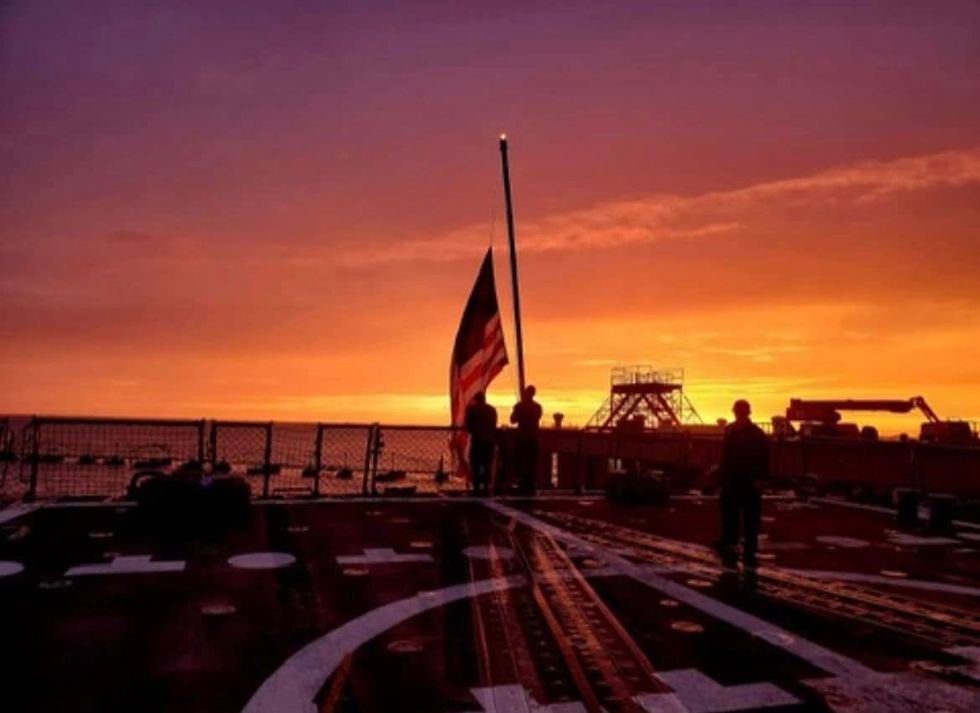 Navy ship deck at sunset