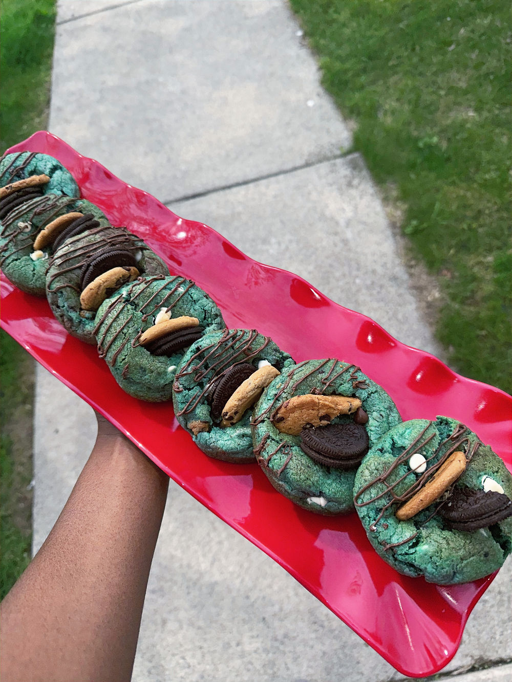 Assortment of green cookies with different flavors and toppings