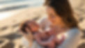 can you give me pictures of moms breastfeeding on the beach or on the beach with a newborn