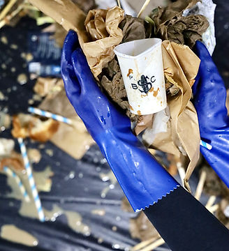 Blue Sparrow Coffee cleanup: gloved hands collect litter