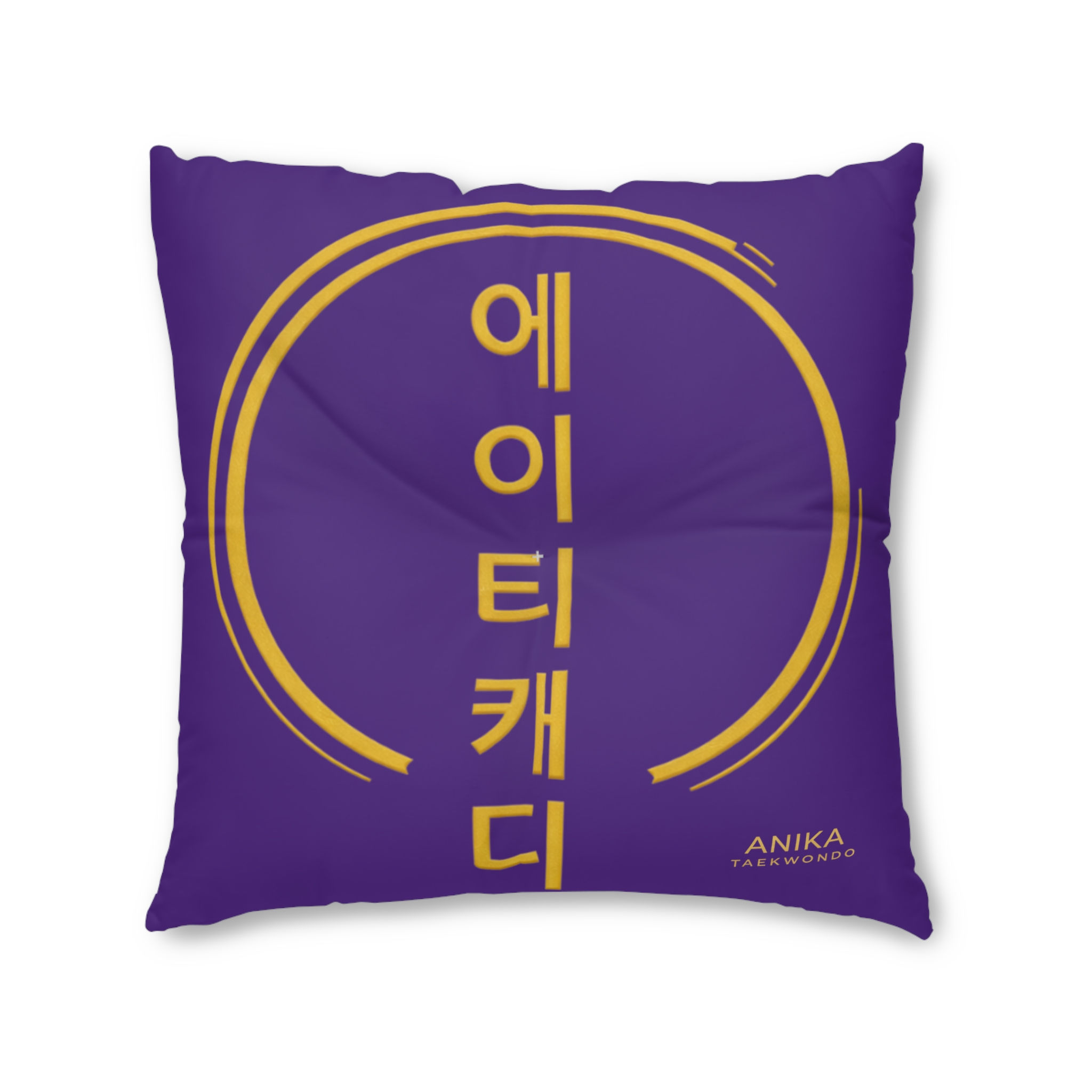 Purple pillow with yellow Anika Guitar Girl logo