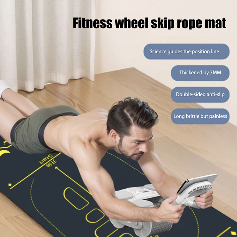 Miniature : Man using ab roller on a fitness wheel skip rope mat