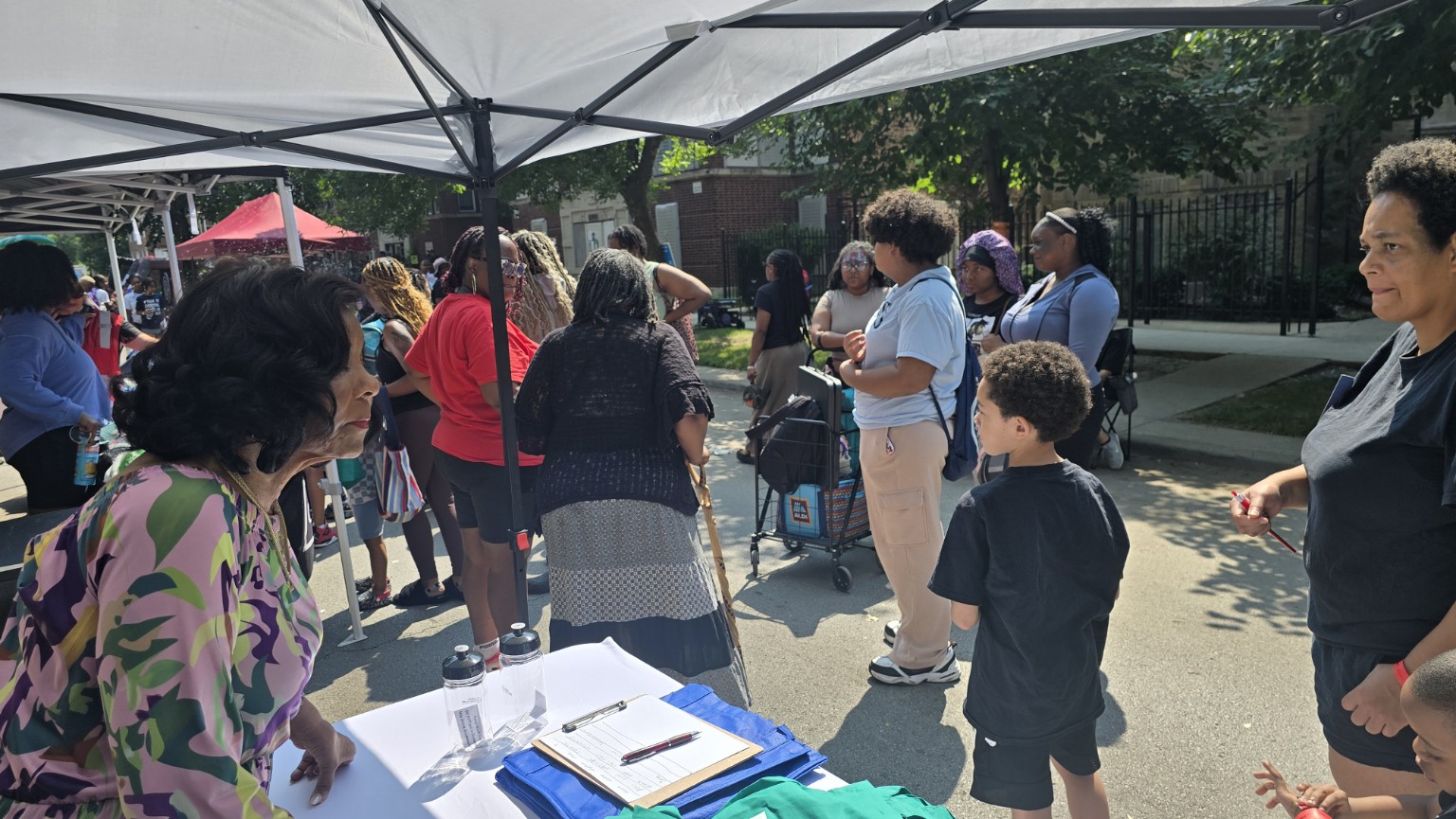 Neighbors gathering at an NNA resource table