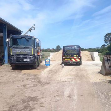 Two concrete mixing vehicles