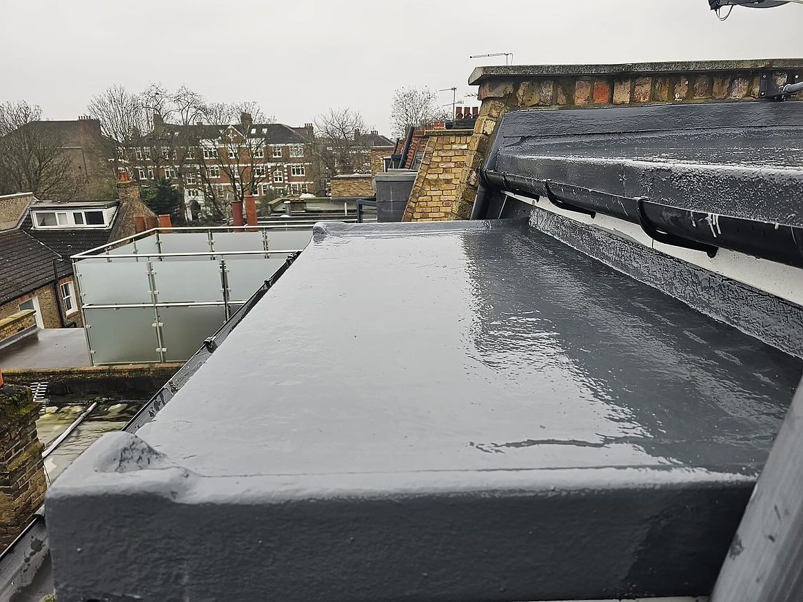 Newly refurbished flat roof with a dark grey rubber covering