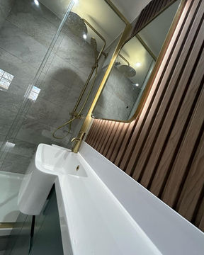 White sink with a gold tap