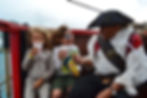 Pirate crew interacting with two boys 
