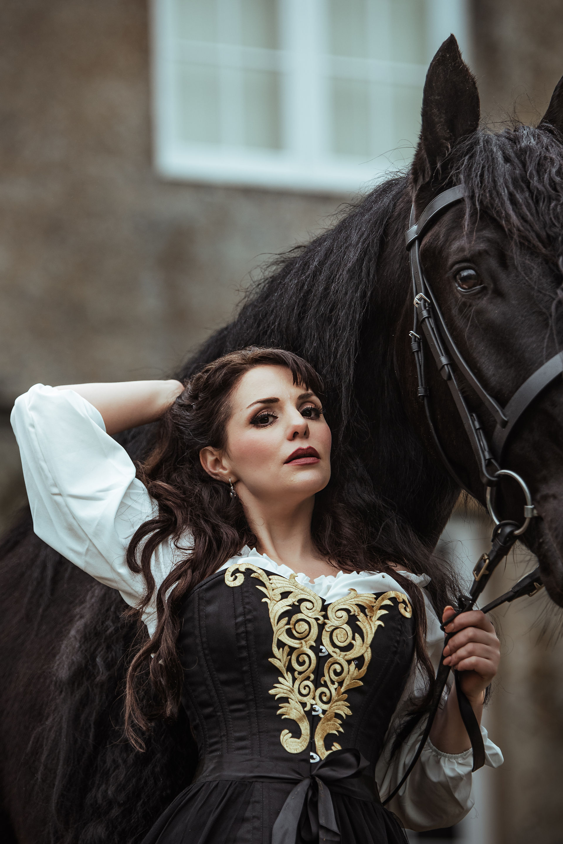 A baroque equine photoshoot with a black Murgese horse at Boughton House