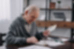 senior-man-in-casual-clothes-sitting-at-table-with-2024-11-19-04-39-03-utc.jpg
