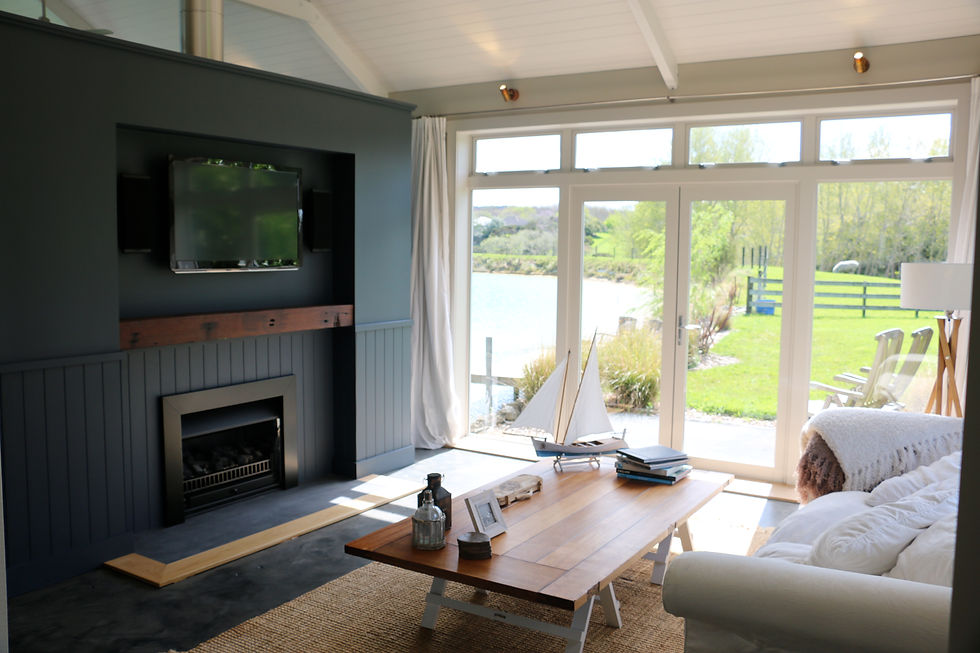 Boathouse Row in Coatesville, Auckland - Luxury Accommodation Lounge with fireplace