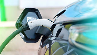 plugged-charger-into-electric-car-charge-station-Gulu-Electrical-Contractors.jpg