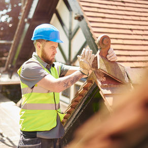 Construction worker working on roof in the heat of summer